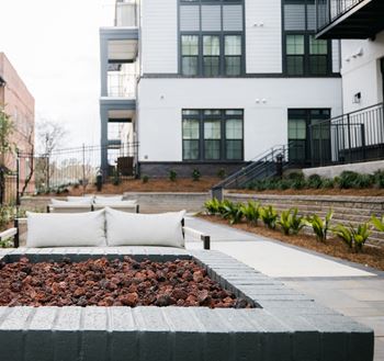 Outdoor courtyard with fire pit at The Quarter House, Jackson, 39216